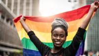 Woman Waving Rainbow Flag at Gay Parade